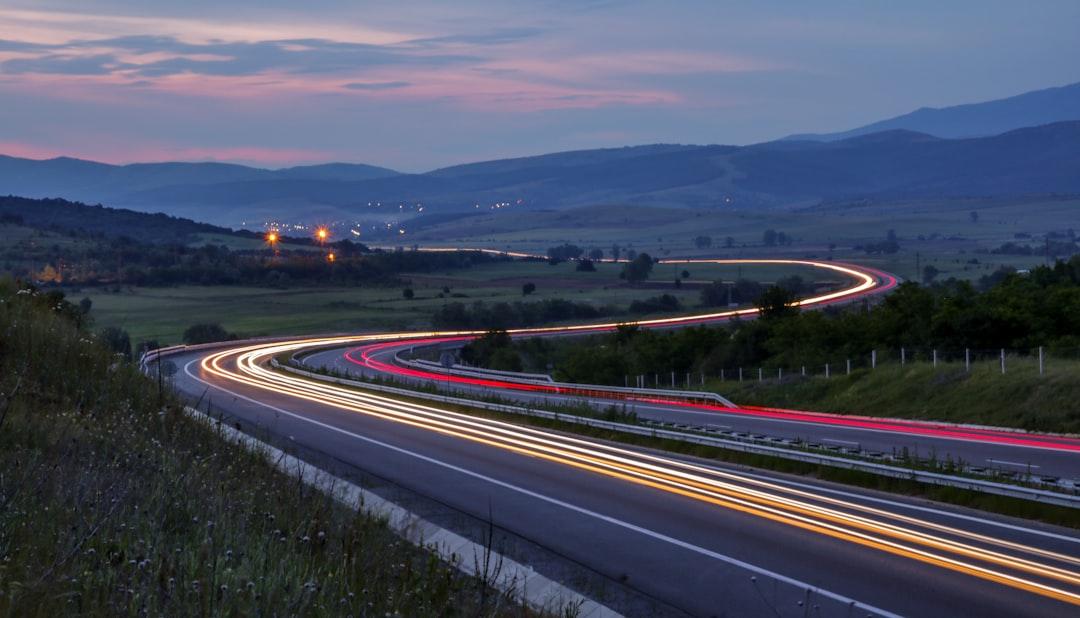 Car light trails on a winding highway