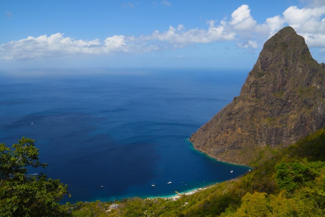 This is one of the two Pitons, huge volcanic plugs on the island of St. Lucia, a tourist destination in the Caribbean.  I trekked to the top of a nature reserve to be rewarded by this stunning view of one of the bays next to the Pitons.