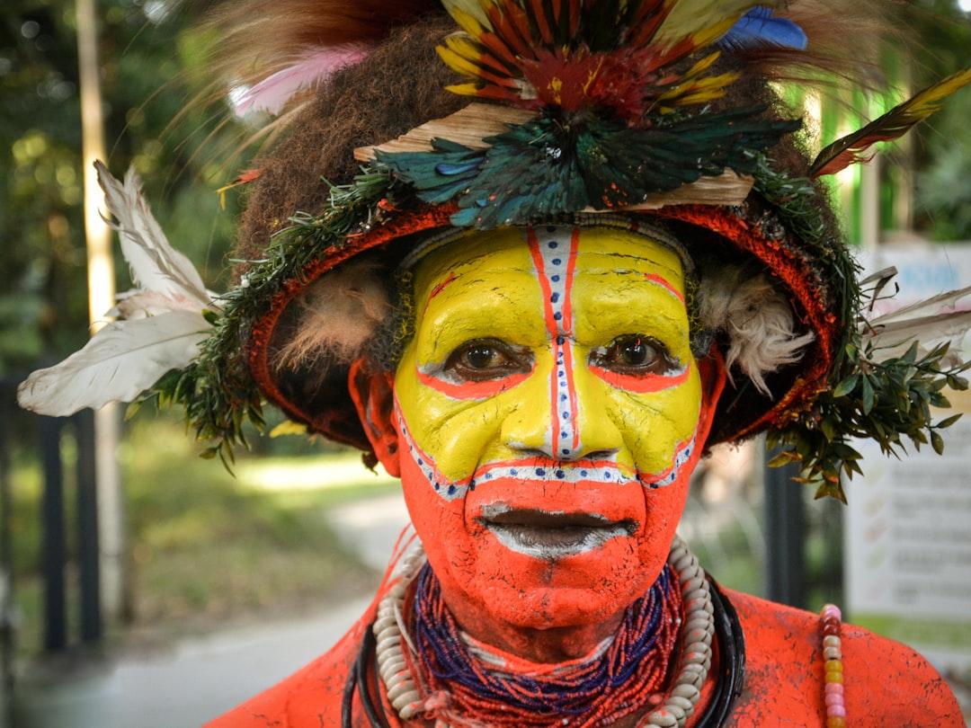 Portrait of one of the local groups in Papua New Guinea. The face and body paint as well as the head gear is amazing.