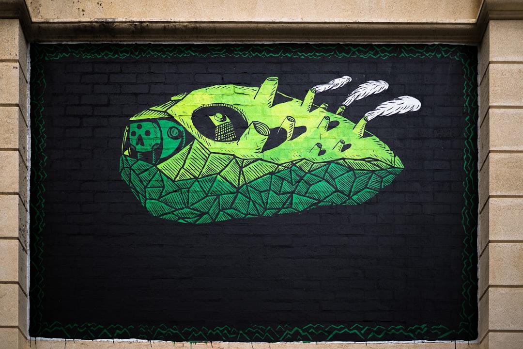 Vibrant and unique green on black street art in Perth city centre. 