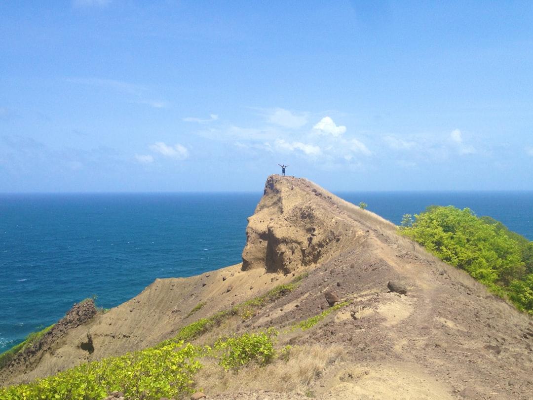 man standing on rock edge