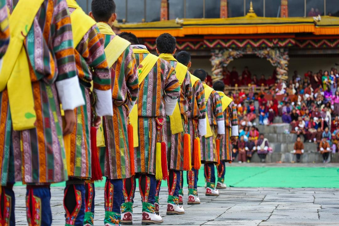 A group of male dancers get ready for a traditional item during Thimphu Tshechu (festival).