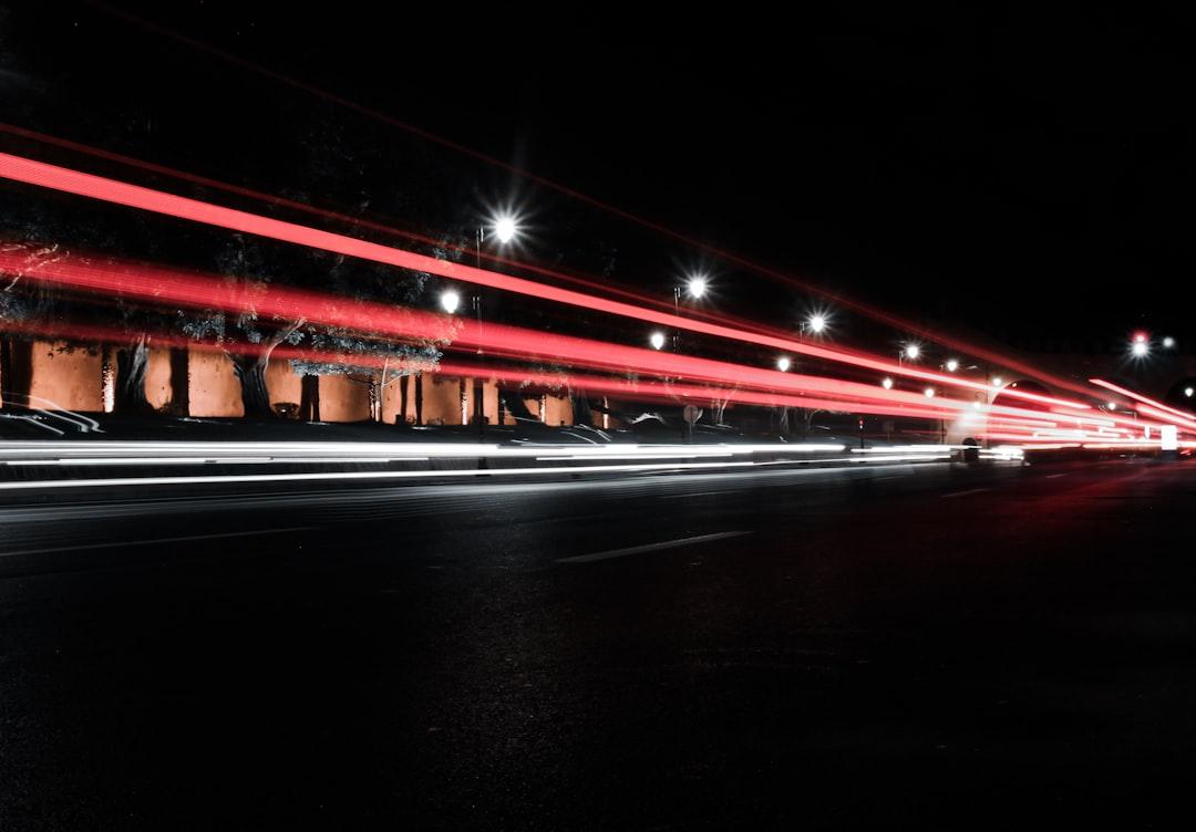 red bridge with lights during night time