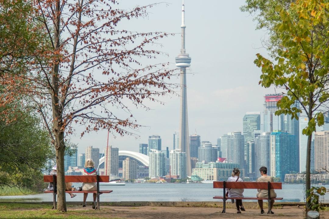 On a beautiful autumn afternoon on the Toronto Island, 3 ladies enjoy the scenery.