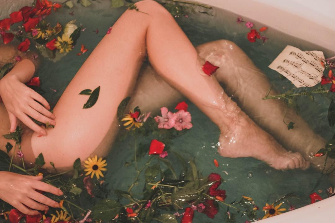 Girl laying in the flower bath