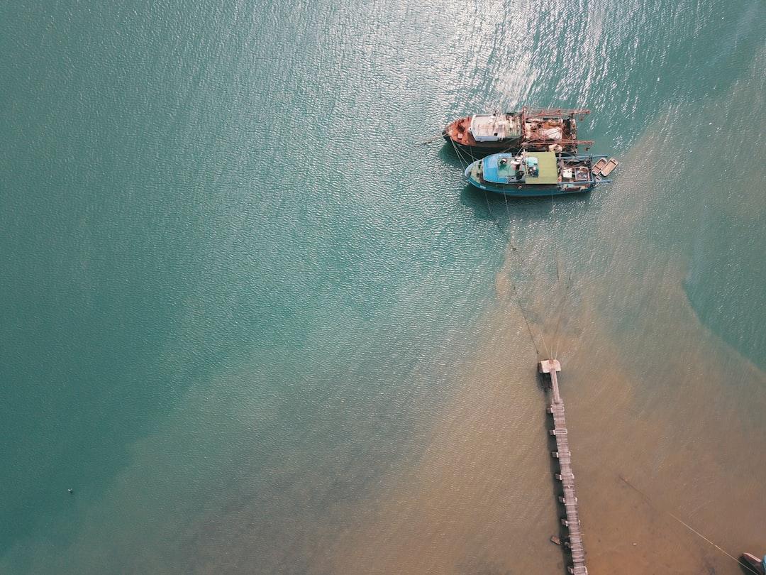 two boats docked near port in aerial photography