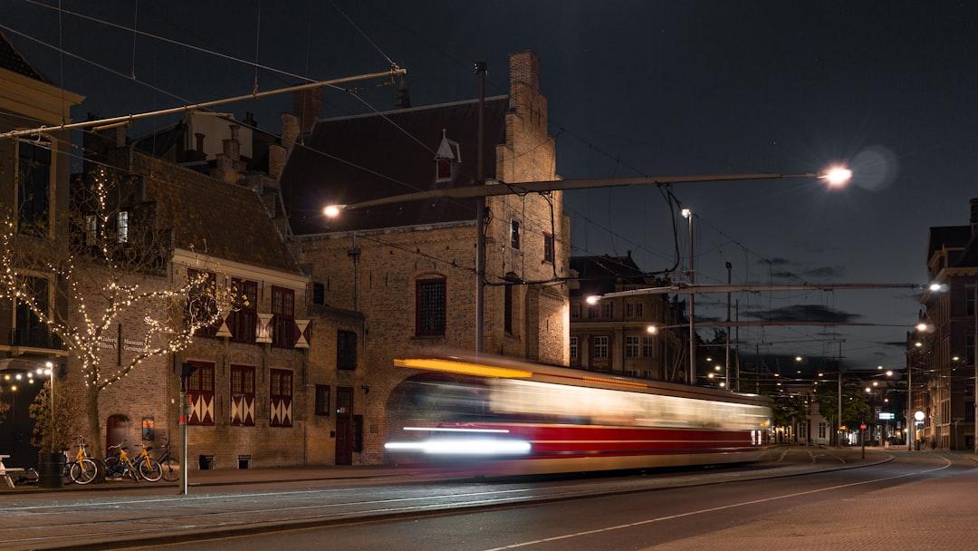 time-lapse photography of bus on road at nighttime