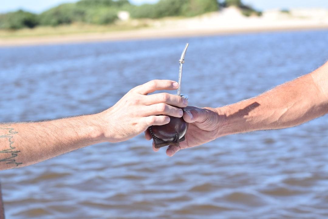 person holding black fishing rod
