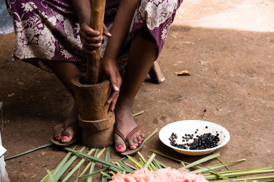 A girl grinds coffee beans during a traditional Ethiopian coffee ceremony