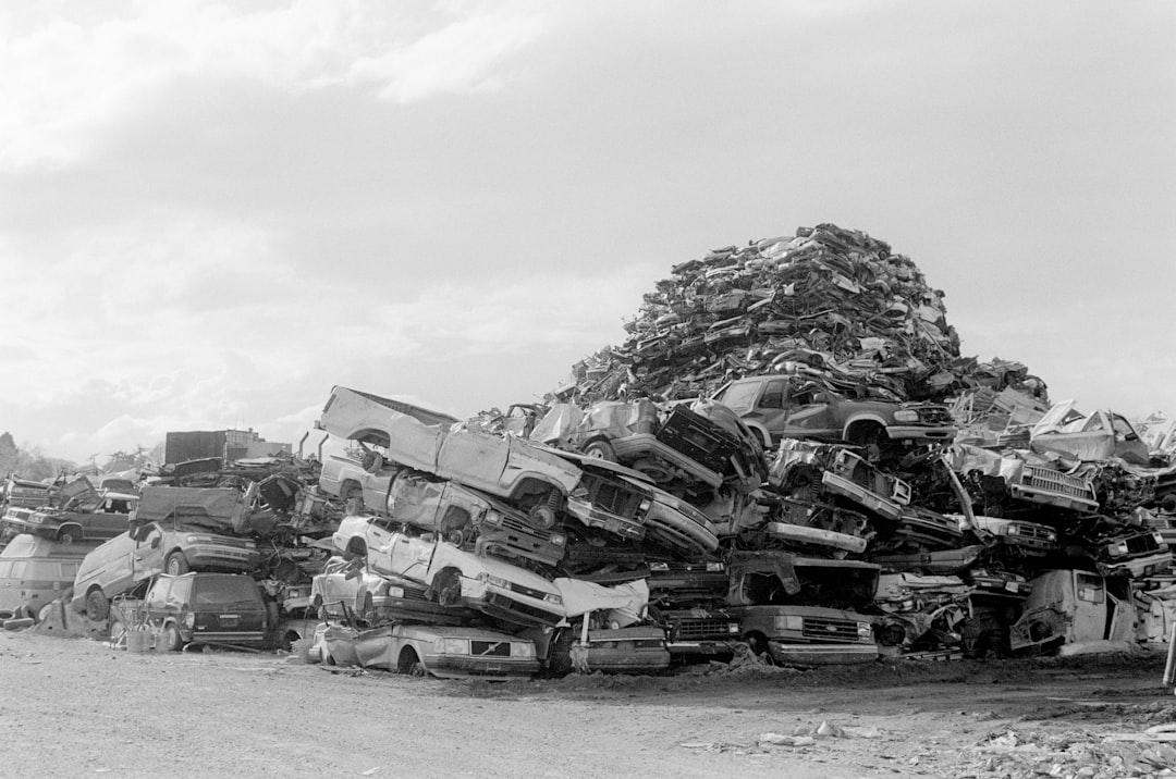 Piles of used cars and trucks waiting to be recycled.