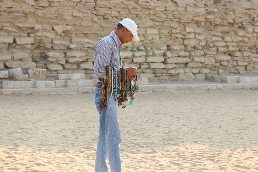 A hawker selling handicraft at pyramid cairo.