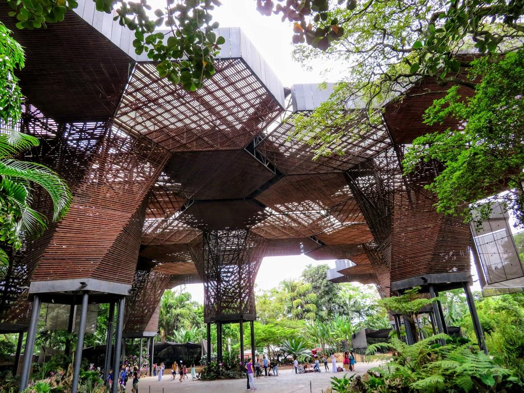 Designed by Plan B Architects in Medellin, the Orquideorama structure resembles a bouquet of giant wooden flowers that stretch more than fifty feet into the air forming a large canopy for patrons to enjoy. The idea behind the design was to blend architecture with the natural world so that the space would fit perfectly within its attachment to the existing Medellin Botanical Gardens. What has been achieved is truly imaginative and fitting for a place dubbed as the city of eternal spring. 